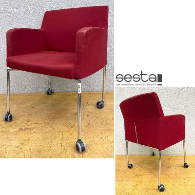 two pictures of a red chair with wheels on a wooden floor