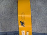 a yellow ribbon that has a bear on it