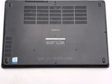 a black laptop with a small battery on top of it