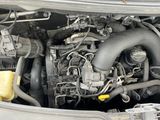 a picture of a car engine with its hood open