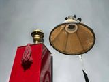 a lamp that is next to a red box