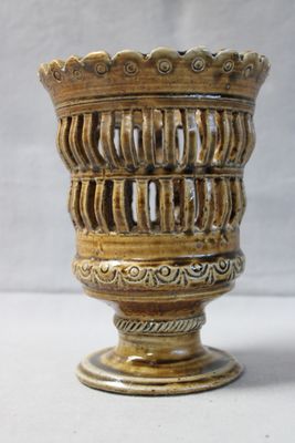 a vase that is sitting on a white surface