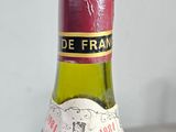 a bottle of wine sitting on a table with a label on it