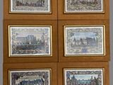 four framed pictures of a city with a clock and a clock tower