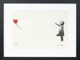 a framed picture of a girl with a red balloon in the shape of a heart