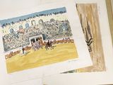 a painting of a horse race being displayed on a table