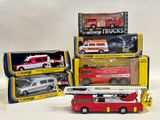 several toy firetrucks and trucks are stacked on top of each other