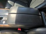 a close up of a seat in a car with a remote control