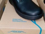 a box with a pair of black shoes on top of it