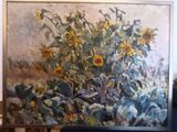 a painting of sunflowers in a vase on a easel