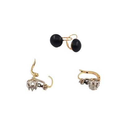 three pairs of earrings with black and white stones on them