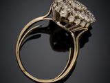 a close up of a diamond ring on a black surface