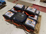 a pile of luggage sitting on top of a pile of hay