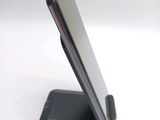 a close up of a cell phone on a stand