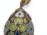 a close up of a pendant on a white background with a white background