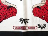 a white and black shirt with a red and black design on it