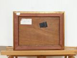 a picture of a painting on a easel with a piece of paper on top of it