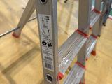 a ladder that is sitting on the floor in the room