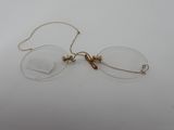 an image of a pair of glasses sitting on top of a table
