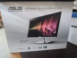 an asus desktop computer box sitting on a table in a store