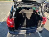 a car with its trunk open in a parking lot