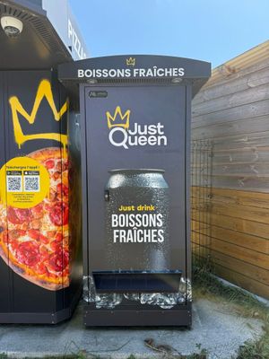 two vending machines that have a pizza on them