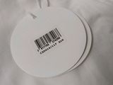 a label on the back of a white shirt with a barcode on it