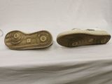 a close up of a pair of shoes on a white surface