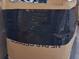 a large pile of boxes sitting on a pallet in a garage