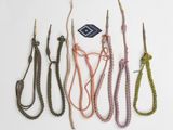 several different types of rope are tied together on a white surface