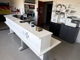 an image of a kitchen with a counter and a refrigerator