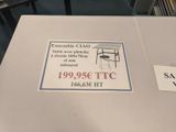 a picture of a table that has a sign on it