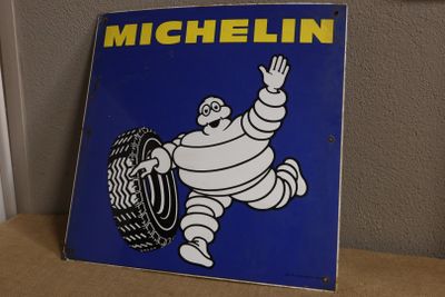 a michel tire sign on a shelf in a room