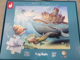 a puzzle box with a picture of a mermaid and a whale