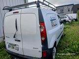 a white van that is parked in the grass