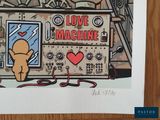 a picture of a picture of a machine with a teddy bear on it