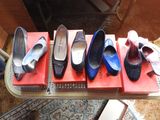 several pairs of shoes are lined up on a table