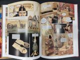 an open comic book with a picture of a man and a woman on it