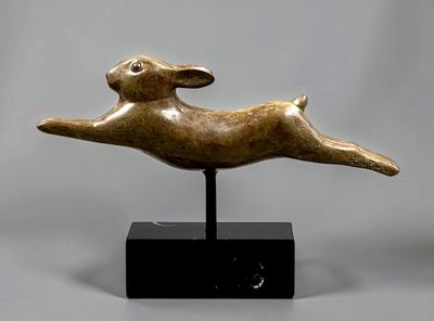 an image of a bronze sculpture of a rabbit on a black base