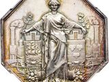 an image of a silver medal with a woman standing in a garden
