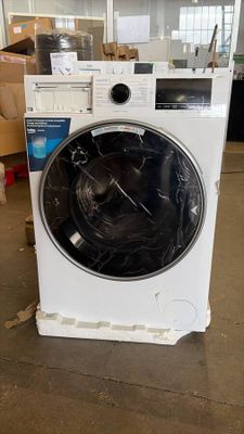 a washing machine that is sitting on the floor