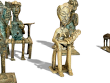 three bronze sculptures of people sitting on a bench next to each other