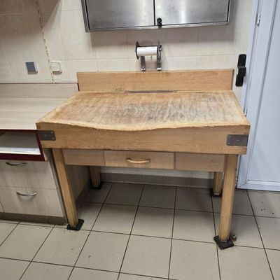 a kitchen with a sink and a counter in it