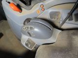 a car dashboard with a steering control and a steering wheel