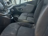 a picture of the inside of a van with the driver ' s seat up