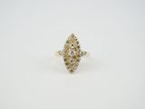 a yellow and white diamond ring on a white surface