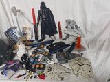 a lot of star wars action figures on a table