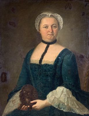 portrait of a woman in a blue dress holding a dog