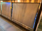 a large stainless steel refrigerator in the middle of a kitchen