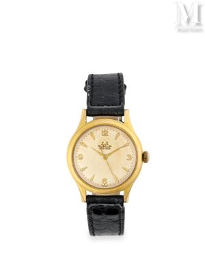 une photo d'une montre-bracelet pour femme, avec un boîtier en or et un bracelet en cuir noir